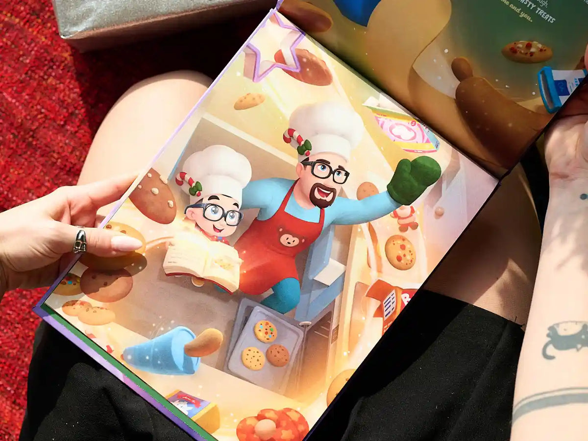 Une illustration tirée d'un livre de Noël personnalisé où papa et son petit préparent des biscuits.